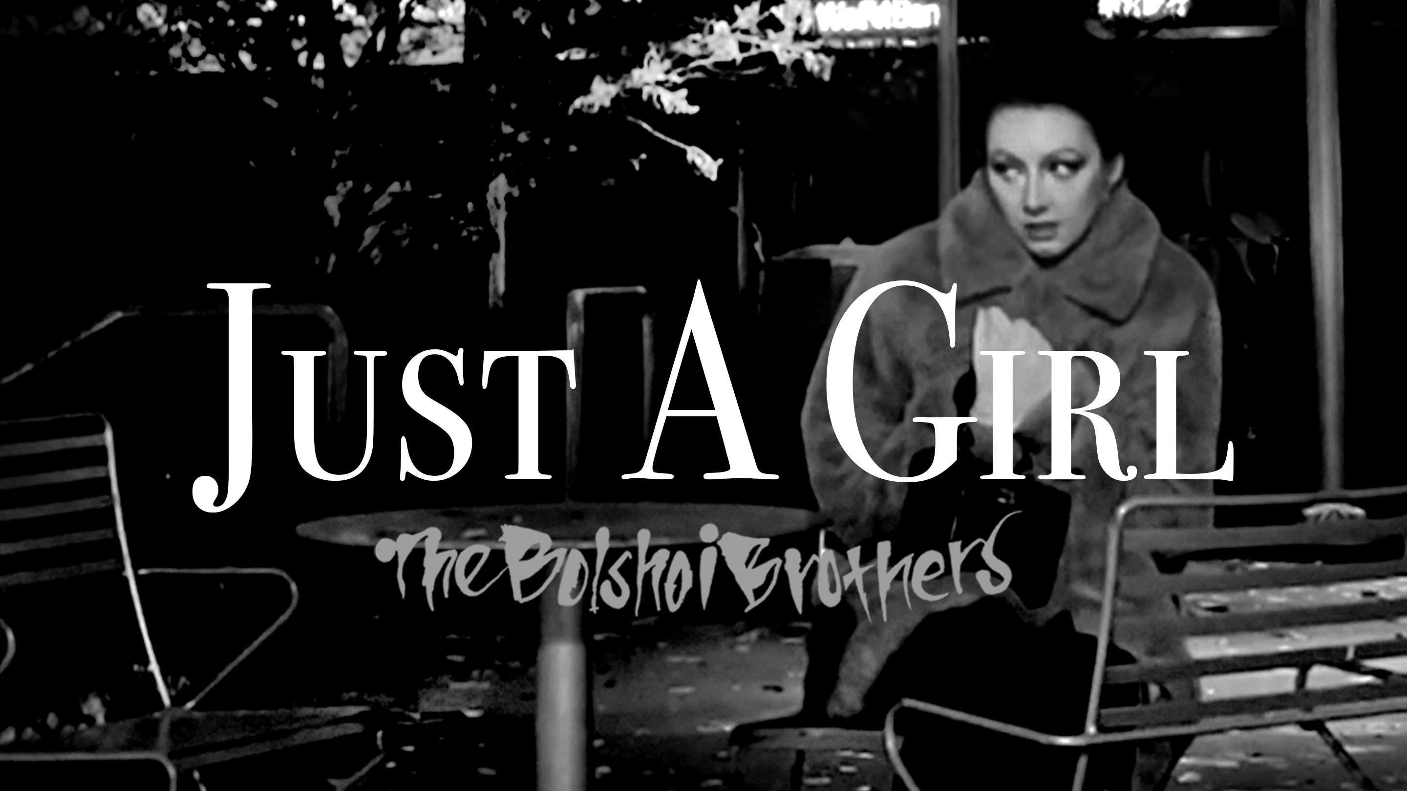 This is a screen grab from the Just A Girl video used as a promo. The video was shot on location in Seattle's International District, Golden Gardens Beach and Jacksonville Beach in Florida. This particular location was in Hing Hay Park and shows Nova Clark as The Girl - The Bolshoi Brothers